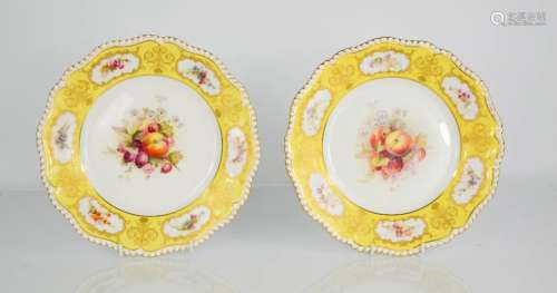 A pair of Royal Worcester plates, hand painted with fruit groups, both signed, one by Hale.