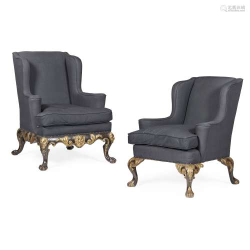 TWO GEORGE II STYLE EBONISED MAHOGANY AND PARCEL GILT WING ARMCHAIRS LATE 19TH/ EARLY 20TH CENTURY