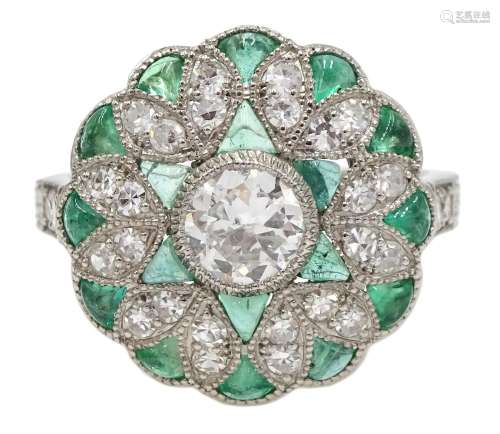 Platinum diamond ring, filigree style surround set with emerald and diamonds and diamond shoulders