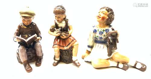 Three Royal Copehagen figurines designed by Dahl Jensen, the first modelled as a girl with elephant