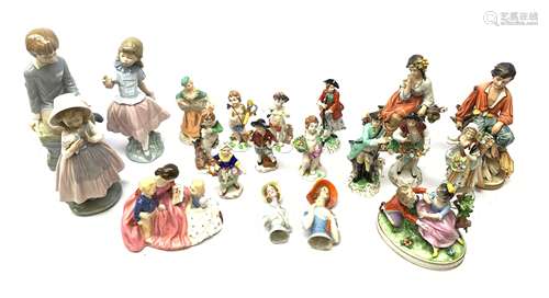 A group of assorted figurines, comprising a Royal Doulton figurine The Bedtime Story Hn2059, a pair