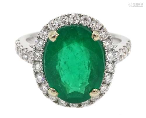 18ct white gold oval emerald and diamond ring, with diamond set shoulders, hallmarked, emerald appr