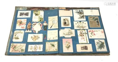 Victorian scrap book containing twenty linen covered leaves fully stocked with Victorian and early