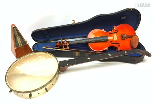 A cased Stentor Student violin and bow, together with a J E Dallas banjo with inlaid mother of pear