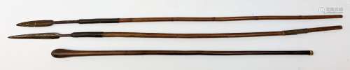 Two tribal hunting spears, one example with bamboo cane, each approx L111cm, together with a club.