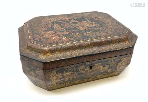 A 19th century black lacquer Chinese box, of rectangular form with canted corners, decorated in red