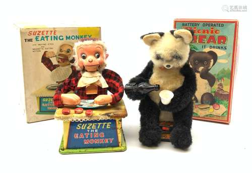 Two Japanese battery operated toys, comprising Pinic Bear, and Suzette the eating monkey, each in b
