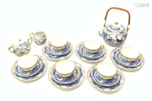 A Japanese eggshell porcelain teaset, comprising six teacups each with Geisha lithophane panel, six