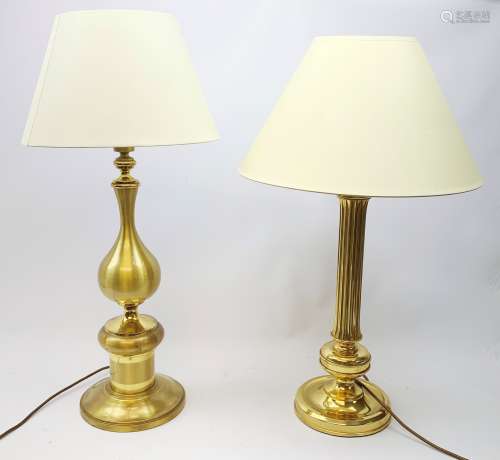 Two large gilt metal table lamps, each with accompanying cream fabric shade, largest H77cm high.