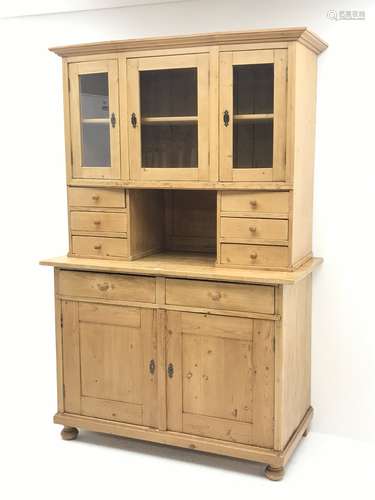 Early 20th century pine kitchen cupboard, raised glazed cabinets with drawers, lower section fitted