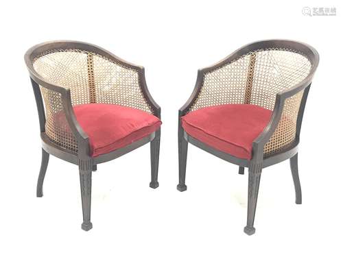 Pair Early 20th century Georgian style mahogany bergere armchairs, square tapering supports carved w