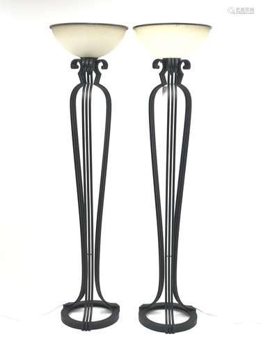 Pair of black painted metal floor standing uplighter lamps, each of skeletal form with three cluster