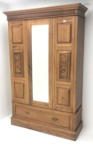 Late Victorian satin walnut wardrobe, projecting cornice, single mirrored door above drawer, plinth