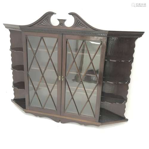 Early 20th century wall hanging display cabinet, swan neck pediment, two door enclosing three shelv