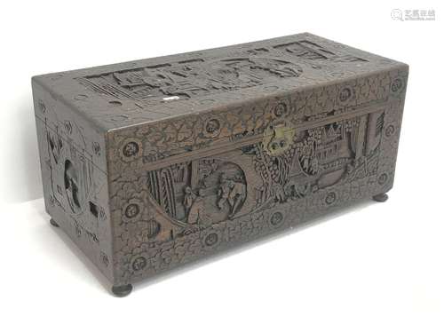 Eastern carved camphor wood blanket box depicting urban scene, W94cm, H49cm, D45cm