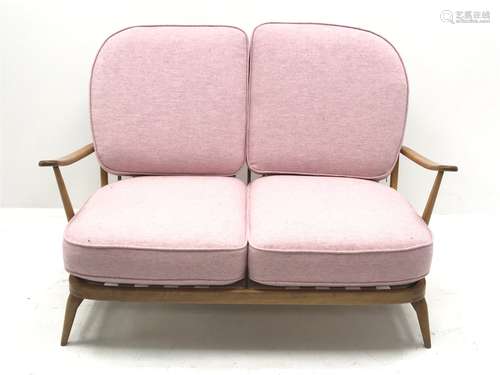 Ercol 'Windsor' beech frame two seat sofa with loose cushions upholstered in pink fabric, W134cm