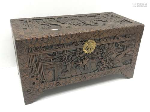 Eastern carved camphor wood blanket box depicting village scene, W94cm, H49cm, D45cm