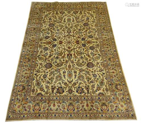 Persian Kashan rug carpet, ivory ground decorated with interlacing scrolled foliage and stylised flo