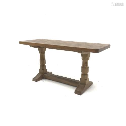 'Mouseman' adzed Yorkshire oak coffee table, rectangular top raised on octagonal supports with sledg