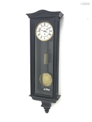 Early 20th century ebonised Vienna type wall clock, shaped pediment over arch glazed door, circular