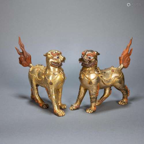 A PAIR OF ANCIENT CHINESE GILT BRONZE BEASTS