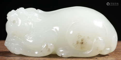 A XINJIANG HETIAN JADE CARVED BEAST SHAPE PENDANT