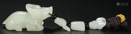 A HETIAN JADE CARVED BULL SHAPE PENDANT