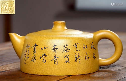 A POETRY PATTERN GOLD MUD ZISHA POT BY HUANGWEIMIN