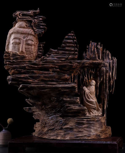 A ZHANG WOOD CARVED BUDDHA SHAPE STATUE