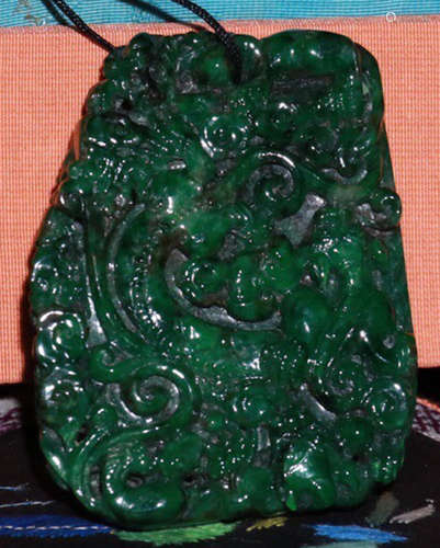 A JADEITE CARVED BEAST PATTERN TABLET