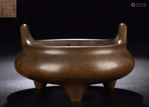 A COPPER CASTED TRIPOD CENSER