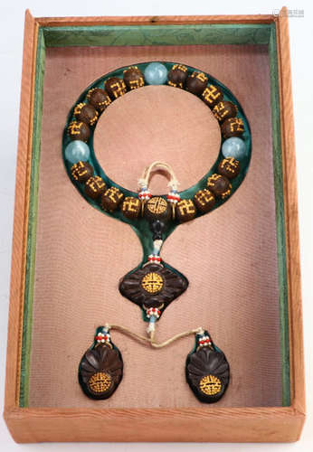 A CHENXIANG WOOD WITH GILT BRONZE BRACELET