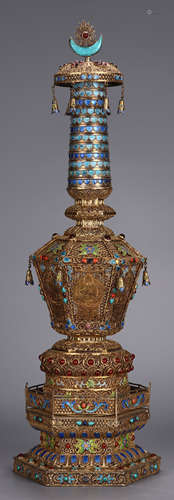 A GILT SILVER CASTED PAGODA WITH GEM