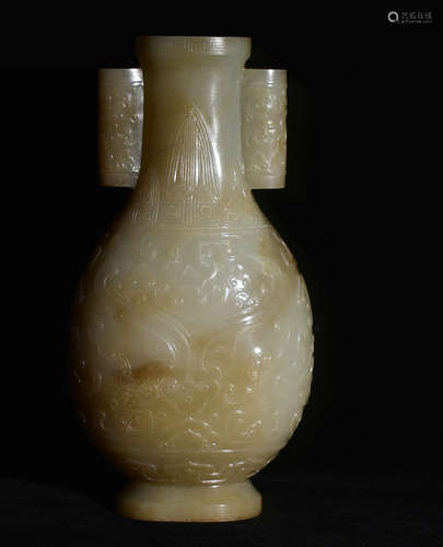 A BOTTLE WITH DOUBLE EARS AND CARVED WITH BAEST PATTERNS