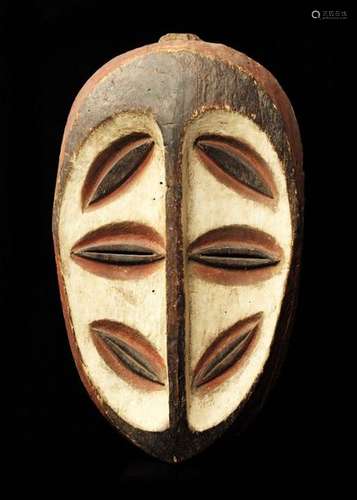 Kwele Mask \nA flat, oval surface. Six almond shape…