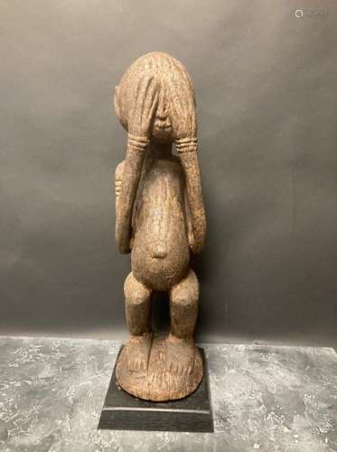 Statuette of adoration representing a Dogon charac…