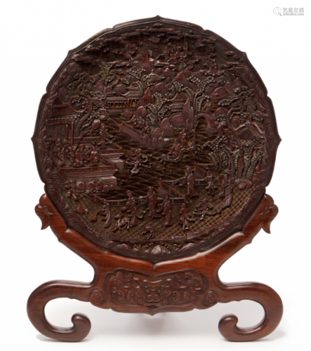 A CARVED CINNABAR LACQUER CHARGER