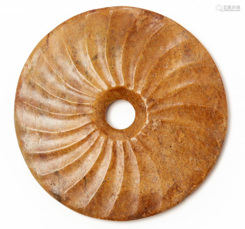 A SPIRALLY FLUTED CARVED JADE BI DISK