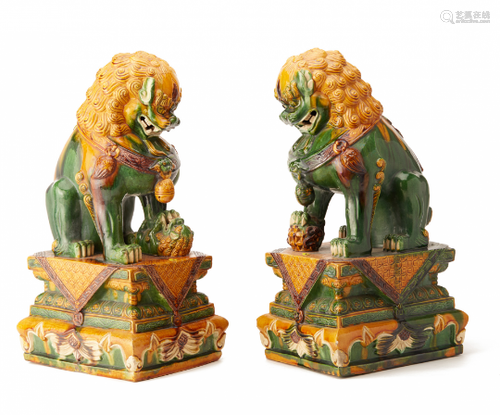 A PAIR OF LARGE SANCAI GLAZED POTTERY FOO DOGS