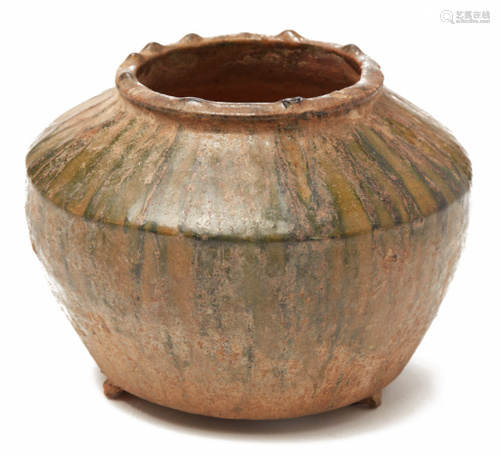 A GREEN-GLAZED POTTERY JAR