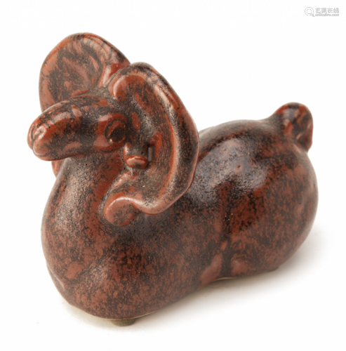 A GLAZED POTTERY MODEL OF A RAM