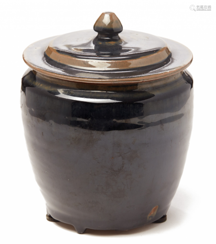 A BLACK-GLAZED JAR AND COVER