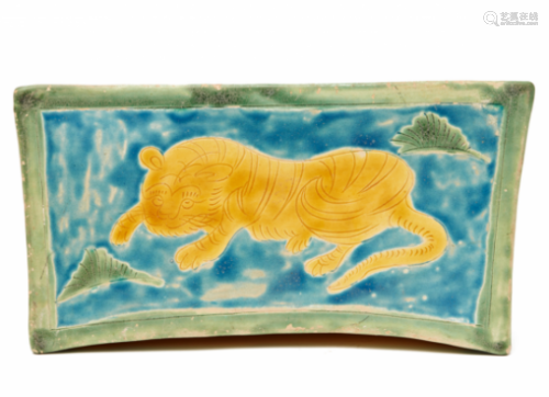 A SANCAI-GLAZED PILLOW WITH A TIGER