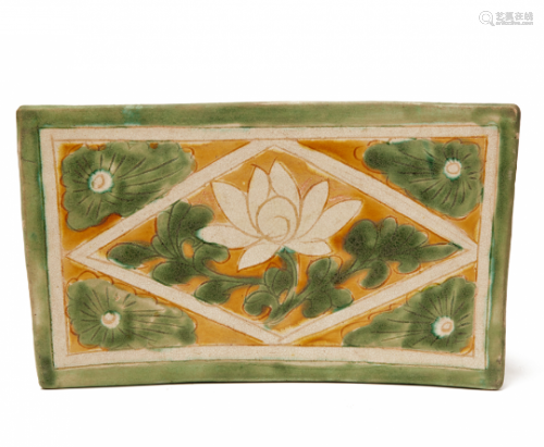 A CIZHOU SANCAI-GLAZED PILLOW WITH LOTUS