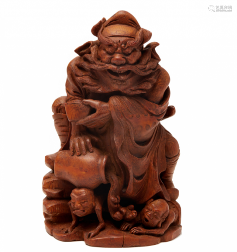 A BAMBOO ROOT CARVING OF A DEITY