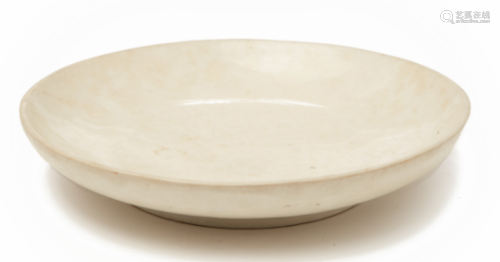 AN INCISED WHITE-GLAZED CHARGER