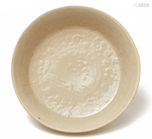 A MOULDED WHITE-GLAZED SHALLOW DISH