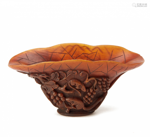 A CARVED HORN LIBATION CUP