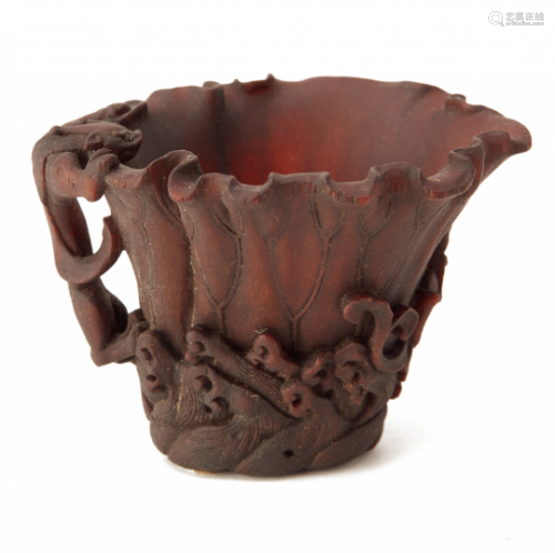 A SMALL CARVED HORN LIBATION CUP