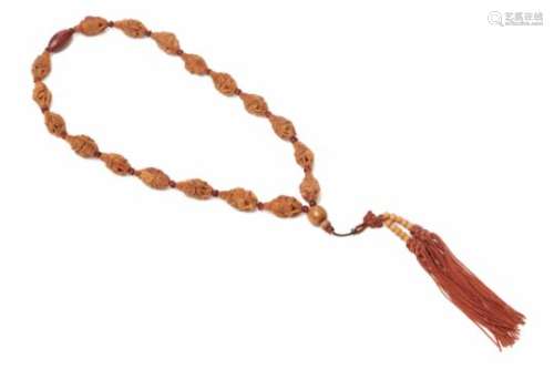 A CARVED FIGURAL BEAD NECKLACE